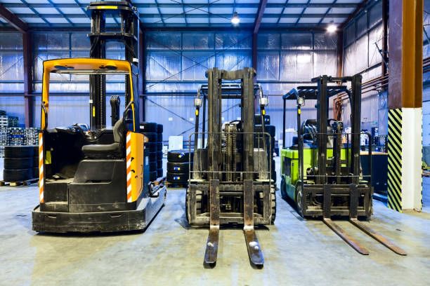 Three forklift in the large modern warehouse
